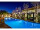 Night view of an outdoor pool with private cabanas creating a luxurious and relaxing ambiance at 4471 Dean Martin Dr # 4001, Las Vegas, NV 89103