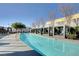 Resort-style swimming pool with private cabanas, mature trees and blue water at 4471 Dean Martin Dr # 4001, Las Vegas, NV 89103