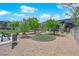 Fenced dog park area with artificial turf provides a safe, pet-friendly space with seating for residents to enjoy at 471 Secret Cove Ct, Henderson, NV 89002