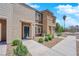 Stylish townhome featuring a modern exterior, neat landscaping, and a welcoming entrance at 471 Secret Cove Ct, Henderson, NV 89002