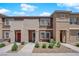 Inviting two-story townhomes with well-maintained landscaping and charming curb appeal at 471 Secret Cove Ct, Henderson, NV 89002