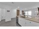 Bright kitchen with island features quartz countertops and white cabinetry at 471 Secret Cove Ct, Henderson, NV 89002