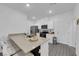 Well-lit kitchen featuring modern appliances, bright white cabinets, and breakfast bar seating at 471 Secret Cove Ct, Henderson, NV 89002