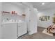 Bright laundry room with modern washer and dryer units at 471 Secret Cove Ct, Henderson, NV 89002
