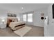 Bright main bedroom features soft carpet, natural light, and neutral decor at 471 Secret Cove Ct, Henderson, NV 89002