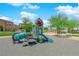 Colorful playground with slide, climbing structures, and tunnel, offering fun outdoor activities for children in a friendly community at 471 Secret Cove Ct, Henderson, NV 89002