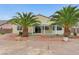 Backyard featuring mature trees, palm trees, and a covered patio at 4910 Cielo Ct, Pahrump, NV 89061