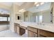 Bathroom featuring double sinks and large mirror at 4910 Cielo Ct, Pahrump, NV 89061
