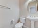 Restroom featuring an elegant pedestal sink and a round mirror at 4910 Cielo Ct, Pahrump, NV 89061
