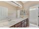 Spacious bathroom with dual sinks, white countertops, and separate toilet at 4910 Cielo Ct, Pahrump, NV 89061