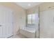 Bright bathroom with a soaking tub and glass-enclosed shower at 4910 Cielo Ct, Pahrump, NV 89061