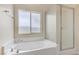 Clean bathroom featuring a soaking tub and glass-enclosed shower at 4910 Cielo Ct, Pahrump, NV 89061