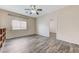 Bedroom featuring wood-look floors, a ceiling fan, and a doorway to another room at 4910 Cielo Ct, Pahrump, NV 89061