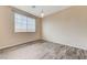 Bright bedroom featuring hardwood floors and natural light from a large window at 4910 Cielo Ct, Pahrump, NV 89061