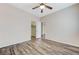 Bedroom featuring a walk-in closet, wood-look flooring, and a neutral color palette at 4910 Cielo Ct, Pahrump, NV 89061