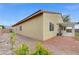 View of the home's exterior showing the backyard, side yard, and covered patio area perfect for entertaining at 4910 Cielo Ct, Pahrump, NV 89061