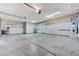 Large, clean garage offering ample storage space, overhead lighting and room for multiple vehicles and projects at 4910 Cielo Ct, Pahrump, NV 89061