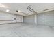Spacious garage featuring an abundance of space for vehicles, storage, and potential workshop areas at 4910 Cielo Ct, Pahrump, NV 89061