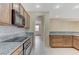 Charming kitchen featuring granite countertops and modern appliances at 4910 Cielo Ct, Pahrump, NV 89061