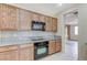 This kitchen features updated appliances, granite counters, and mosaic tile backsplash at 4910 Cielo Ct, Pahrump, NV 89061