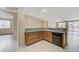 Kitchen with granite counters, wooden cabinets, and an open floor plan at 4910 Cielo Ct, Pahrump, NV 89061