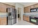 Updated kitchen featuring stainless steel refrigerator and modern appliances at 4910 Cielo Ct, Pahrump, NV 89061