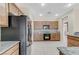 Bright kitchen showcasing stainless steel refrigerator and complementing tile flooring at 4910 Cielo Ct, Pahrump, NV 89061