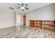 Open living room with wood-look floors and built-in shelving at 4910 Cielo Ct, Pahrump, NV 89061
