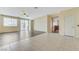 Living room with tile and wood flooring and a sliding glass door leading to the backyard at 4910 Cielo Ct, Pahrump, NV 89061