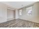The open living room is bright and spacious, featuring stylish wood floors at 4910 Cielo Ct, Pahrump, NV 89061