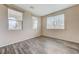 Relaxing living room showcases wood floors and bright light from large windows at 4910 Cielo Ct, Pahrump, NV 89061