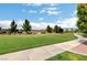 Manicured green space featuring a walking path and mature trees at 4910 Cielo Ct, Pahrump, NV 89061