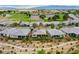 Sweeping aerial view of a residential community with lush landscaping and a golf course at 4914 E Beacon Ridge Dr, Pahrump, NV 89061