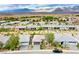 Scenic aerial view of suburban homes with mountain backdrop and meticulously maintained landscaping at 4914 E Beacon Ridge Dr, Pahrump, NV 89061