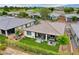 Aerial view featuring a lush backyard with artificial turf, patio and colorful bicycles at 4914 E Beacon Ridge Dr, Pahrump, NV 89061