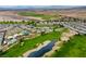 Expansive aerial view of community showcasing golf course, lakes, desert landscape and residential area at 4914 E Beacon Ridge Dr, Pahrump, NV 89061