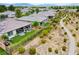 An aerial view showcasing multiple properties with landscaped yards and desert landscaping at 4914 E Beacon Ridge Dr, Pahrump, NV 89061