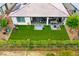 Aerial view of a backyard featuring green lawn, patio furniture, and outdoor living space at 4914 E Beacon Ridge Dr, Pahrump, NV 89061