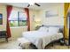 Comfortable bedroom featuring a large window and neutral décor at 4914 E Beacon Ridge Dr, Pahrump, NV 89061