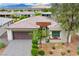 Charming single-story home featuring a desert landscape, two-car garage, and mountain views at 4914 E Beacon Ridge Dr, Pahrump, NV 89061