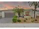Charming single-story home featuring a desert landscape and two-car garage at 4914 E Beacon Ridge Dr, Pahrump, NV 89061