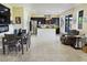 An open living space with an eat-in kitchen, dining table, and a comfortable recliner at 4914 E Beacon Ridge Dr, Pahrump, NV 89061
