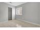 Bedroom featuring neutral walls, a window, a closet, and tiled floors at 523 Rancho Del Norte Dr, North Las Vegas, NV 89031