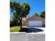 Charming one-story home featuring a two car garage and mature shade tree at 523 Rancho Del Norte Dr, North Las Vegas, NV 89031
