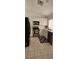 Well-lit kitchen featuring stainless steel appliances, white cabinets, and neutral tile flooring at 523 Rancho Del Norte Dr, North Las Vegas, NV 89031