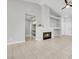 Bright living room featuring a fireplace, neutral color palette, and tile flooring at 523 Rancho Del Norte Dr, North Las Vegas, NV 89031