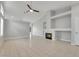 Open living room with tiled floors, fireplace and a ceiling fan at 523 Rancho Del Norte Dr, North Las Vegas, NV 89031