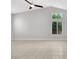 Bright living room with vaulted ceiling, tiled floors, and two windows at 523 Rancho Del Norte Dr, North Las Vegas, NV 89031