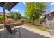 Back patio features pavers, a retaining wall and mature landscaping offering privacy at 5361 Cabrito Dr, Las Vegas, NV 89103