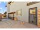 Backyard showing a door, firewood, and a gray exterior at 5361 Cabrito Dr, Las Vegas, NV 89103
